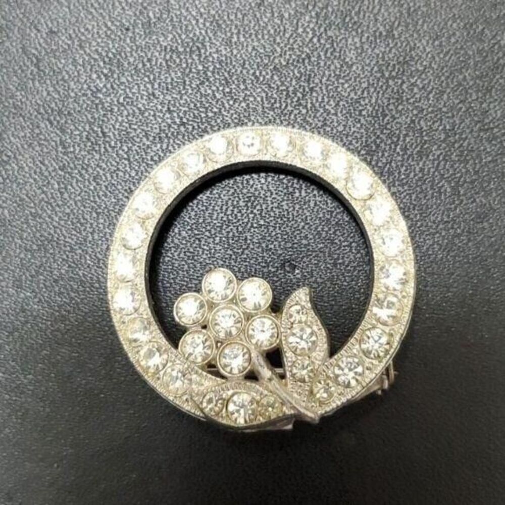 Vintage AJC round silver tone brooch clear rhinestone